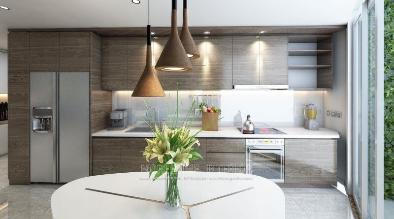 Thiết kế tủ bếp gỗ công nghiệp cho chung cư hiện đại. Để tạo nên không gian bếp ấn tượng, sạch sẽ và rộng rãi, gia chủ đã lựa chọn sử dụng đá ốp bên màu trắng solid surface cao cấp góp phần tạo nên một không gian bếp đẹp mắt Thiết kế và sản xuất tủ bếp đẹp