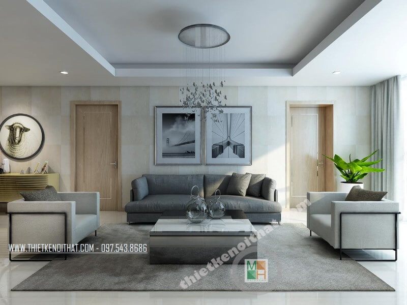 Mẫu thiết kế phòng khách của chung cư hiện đại được làm nổi bật bởi bộ sofa bọc hai màu xám và trắng.